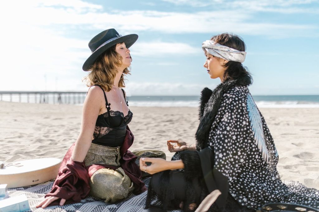 Two Women Sitting on the Beach